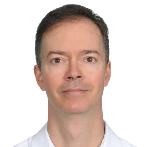 Headshot portrait of Clark Parsons, Managing Director of the Innovate Europe Foundation, in front of a white background.
