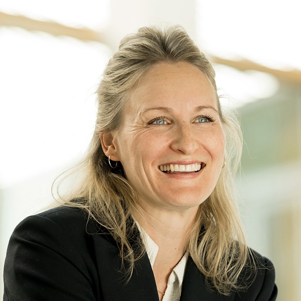 Portrait of Marie Niehaus-Langer, CEO of 3D-printing specialist EOS, smiling, looking right.