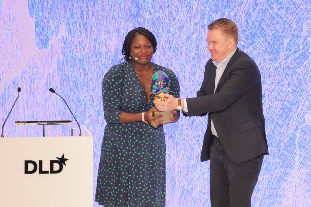 At DLD Munich 2019, Janngo founder Fatoumata Ba receives the Aenne Burda Award from Martin Weiss, Hubert Burda Media