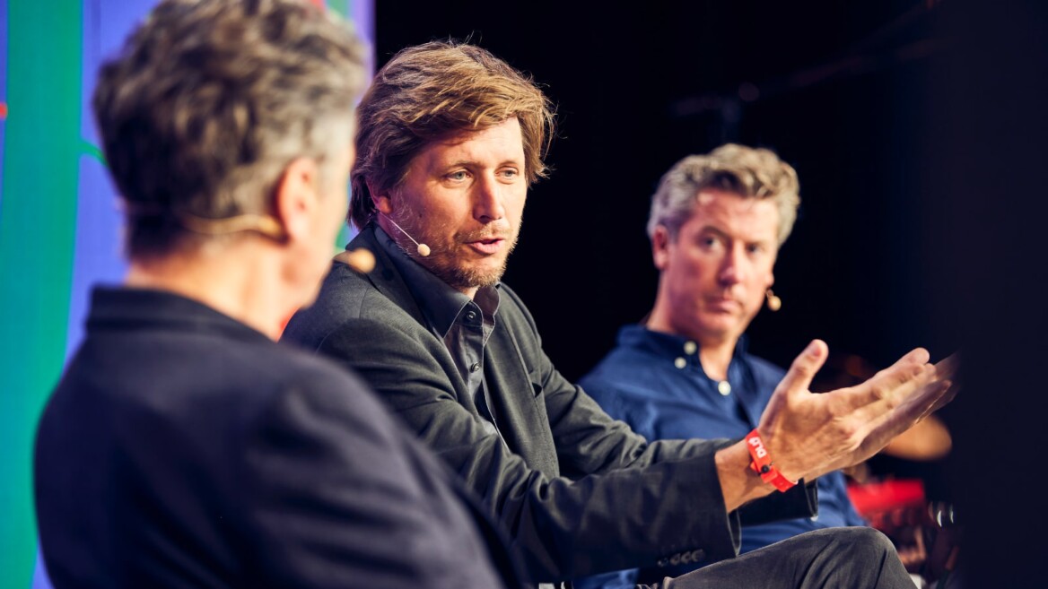 Economist Moritz Schularick (Kiel Institute for the World Economy), in the middle, speaks with Benedikt Franke (Munich Security Conference) and moderator Andrew Keen, left, about the impact of AI on society and politics at the DLD AI Summit 2023.
