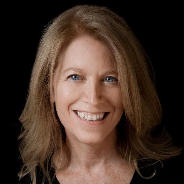 Studio portrait of investor Gigi Danziger (formerly Susan Danziger), smiling at the camera.