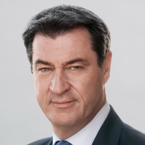 Portrait of Bavarian Minister-President Markus S&ouml;der in front of a grey studio background