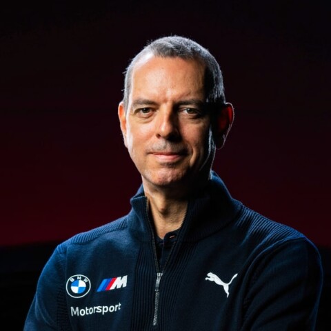 Portrait of Franciscus van Meel, CEO of BMW M, wearing a race car driver’s suit.