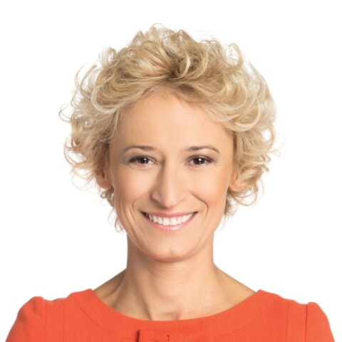Headshot of Polish investor Kinga Stanislawska, Co-Founder of European Women in VC, in a red blouse in front of a clean white background.