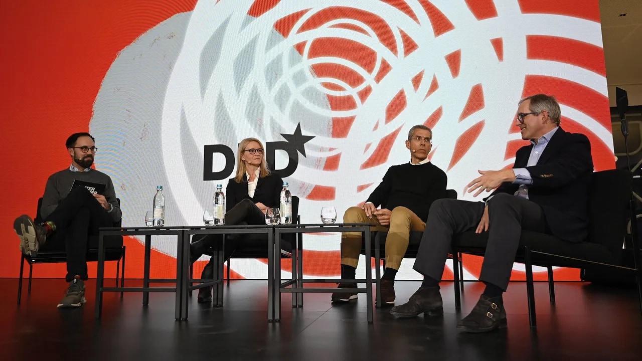 Panelists Christian Mohr, Nicole Gerhardt, Michael Diederich and Christian Haub on stage at the DLD Munich 2024 conference, speaking about managing the rapid pace of innovation in corporations.