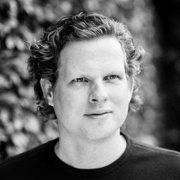 Black-and-white portrait image of Cyriac Roeding, CEO of Earli, looking slightly to the right.