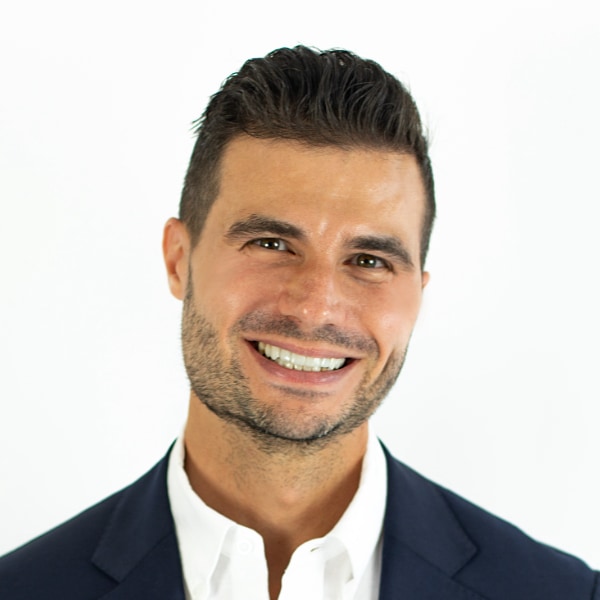 Headshot of NOVOS founder Chris Mirabile in front of a clean white background.