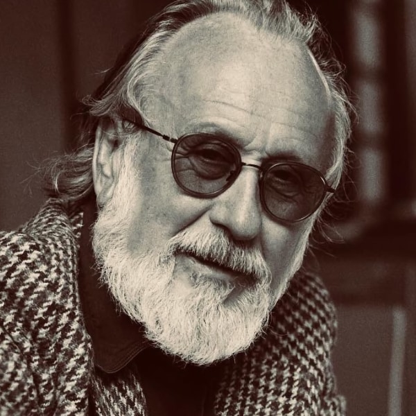 Black-and-white photo of German artist Friedrich Liechtenstein, wearing sunglasses and a beard, smiling at the camera.