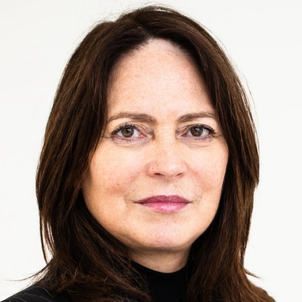 Headshot portrait image of MIT Media Lab Professor Pattie Maes in front of a white background.