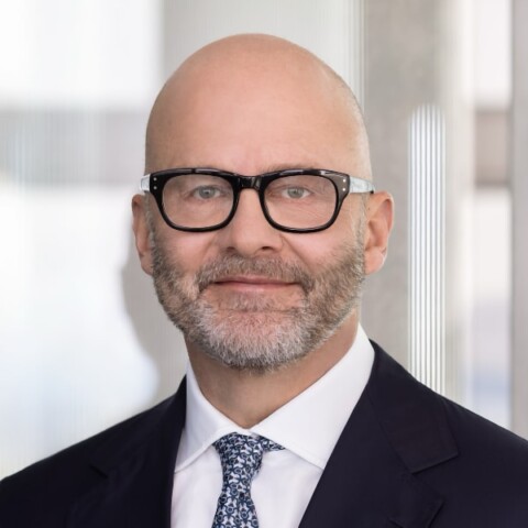 Headshot portrait of Marco Iannaccone, HypoVereinsbank, UniCredit, wearing a suit and tie, looking at the camera.