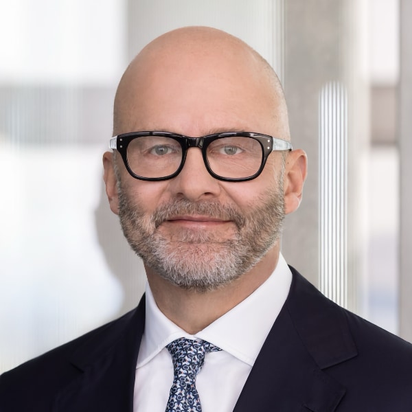 Headshot portrait of Marco Iannaccone, HypoVereinsbank, UniCredit, wearing a suit and tie, looking at the camera.