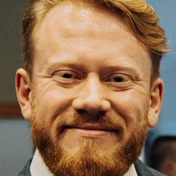 Headshot portrait image of Google quantum AI researcher Tom O’Brien.