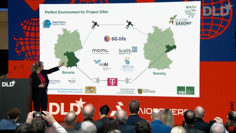 AI expert Gitta Kutyniok, professor at Ludwig Maximilian University of Munich (LMU), presents the Next Generation AI Computing platform at DLD Munich 2025, pointing to a slide showing the cooperation between Bavaria and Saxony.