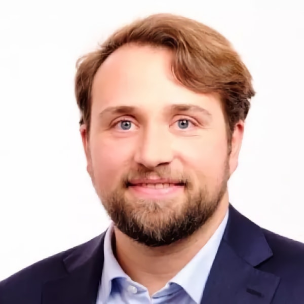 Headshot portrait of BCG partner and sustainability expert Alexander Meyer zum Felde, in front of a white background.