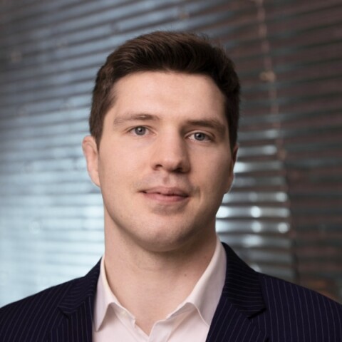 Headshot portrait of Balázs Nagy, CEO and Co-Founder of TYTAN Technologies, in front of a window shade.