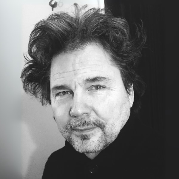 Black-and-white headshot portrait of composer and HealthTunes founder Walter Werzowa