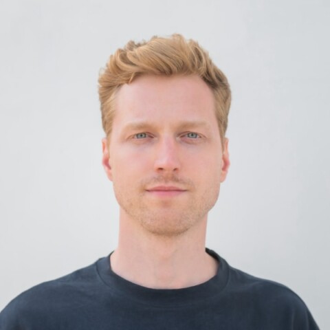 Headshot portrait of Lucas Spreiter, founder of Venta AI, in front of a neutral grey background.