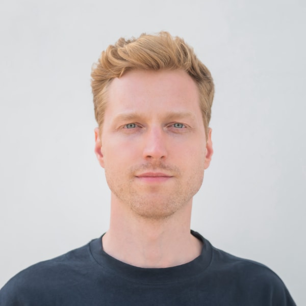 Headshot portrait of Lucas Spreiter, founder of Venta AI, in front of a neutral grey background.