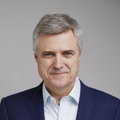Studio headshot portrait of WPP CEO Mark Read in front of a grey background