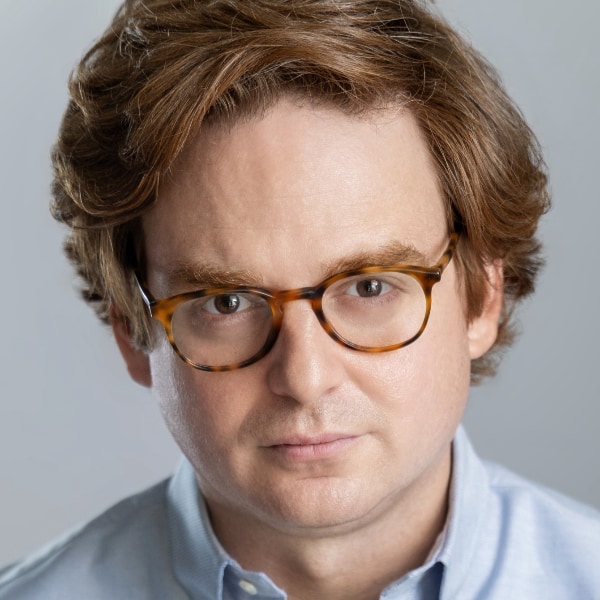 Closely cropped headshot image of Nicholas Zamiska, Palantir, looking sternly at the camera.
