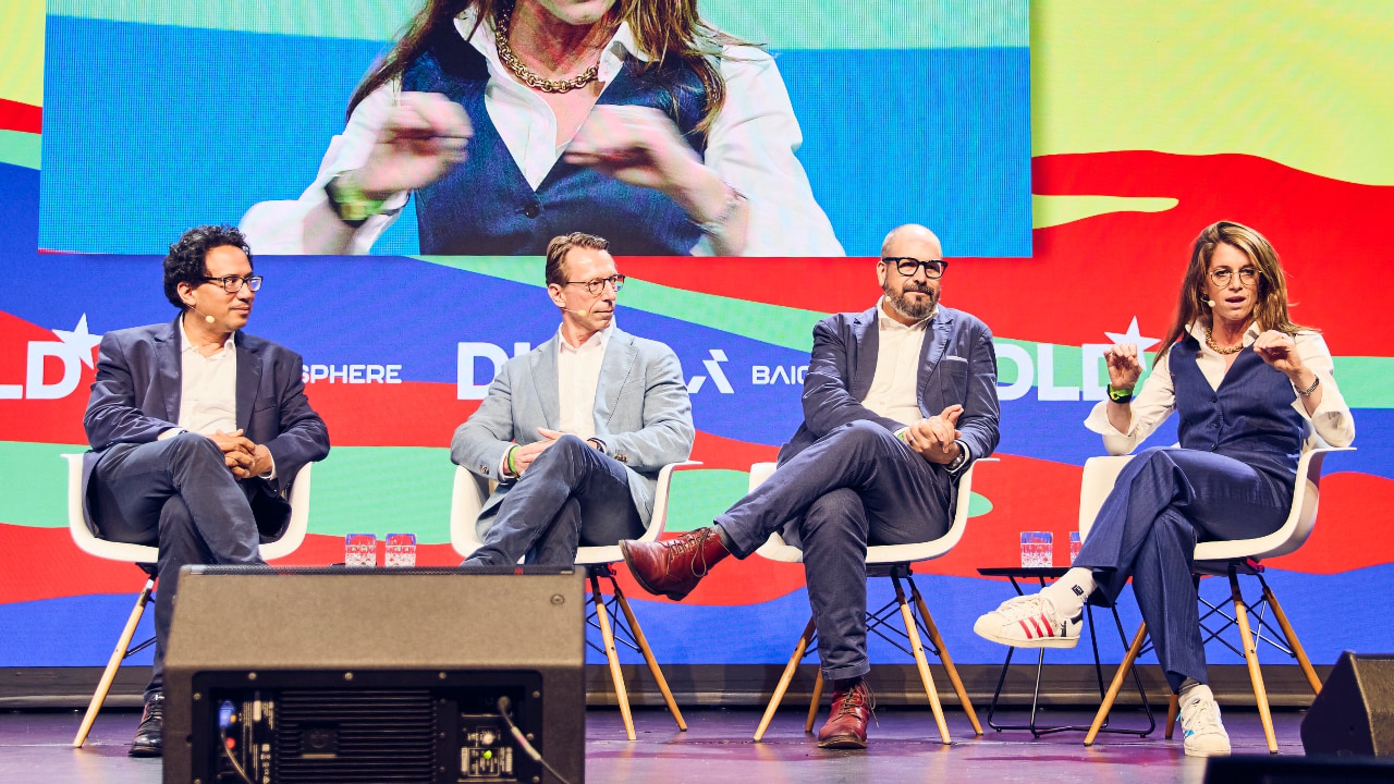 Aldo Faisal (University of Bayreuth/Imperial College London), Rainer Birkenbach (Brainlab), Nick Schneider (German Federal Ministry of Health), and Ariel Dora Stern (Hasso Plattner Institute) on stage at the DLD Future Hub conference in Munich.