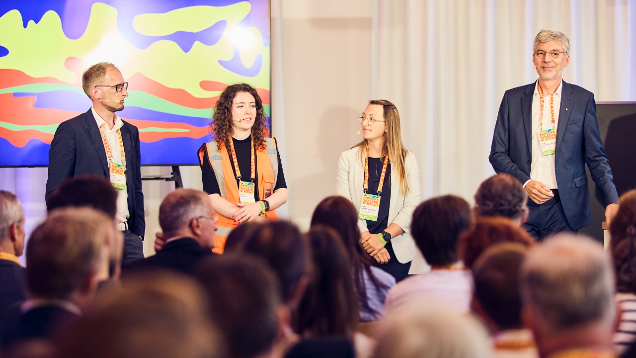Joern Vogel (German Aerospace Center DLR), Annette Hagengruber (German Aerospace Center DLR), Nicola Kolb (Sitegeist Robotics) and Alin Albu-Schaeffer German (Aerospace Center DLR) in front of an audience at the DLD Future Hub conference in Munich.