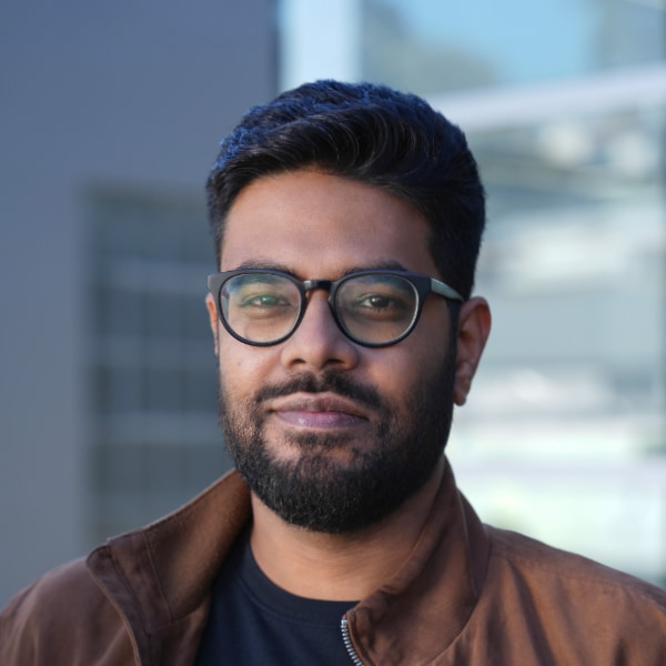 Headshot portrait of Luma AI founder Amit Jain in an office environment.