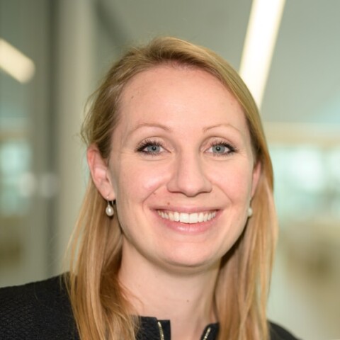 Profile image of Anna Bauer-Mehren, Roche Diagnostics, in an office under neon lights.