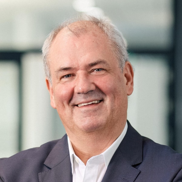 Environmental portrait of Schwarz Digits manager Bernd Wagner, CEO of STACKIT, in an office environment.