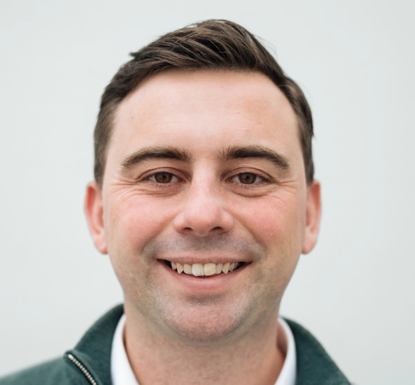 Headshot portrait of Differential Bio CEO, co-founder Christian Spier, in front of a neutral, light grey background.