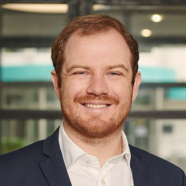 Indoor portrait of venture consultant Dominik Feiden in an office environment.
