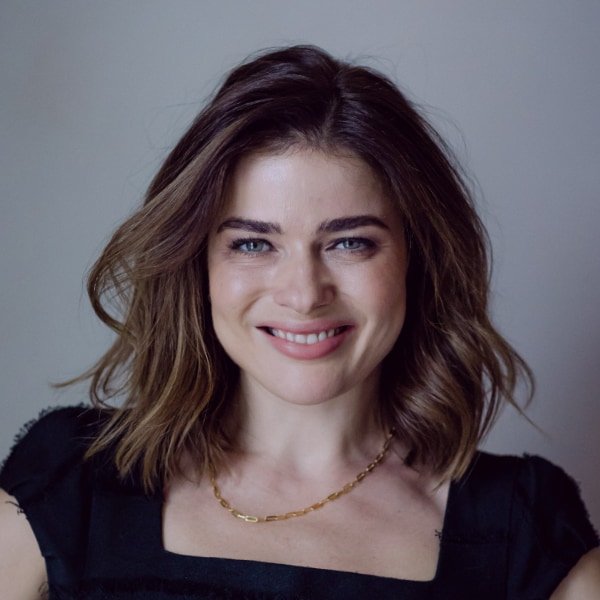 Portrait of venture investor Evgenia Plotnikova, Dawn Capital, in front of a grey studio background
