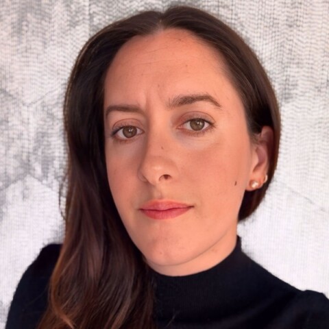 Close-up headshot portrait of Florencia Schiavon, CEO of Sifted, in front of a silver-grey background.