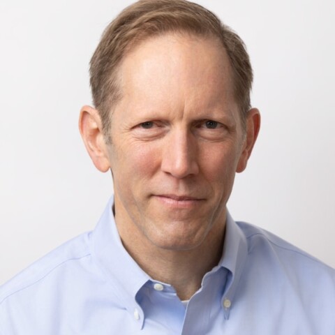 Portrait image of technology analyst and media entrepreneur Henry Blodget in front of a white studio background.