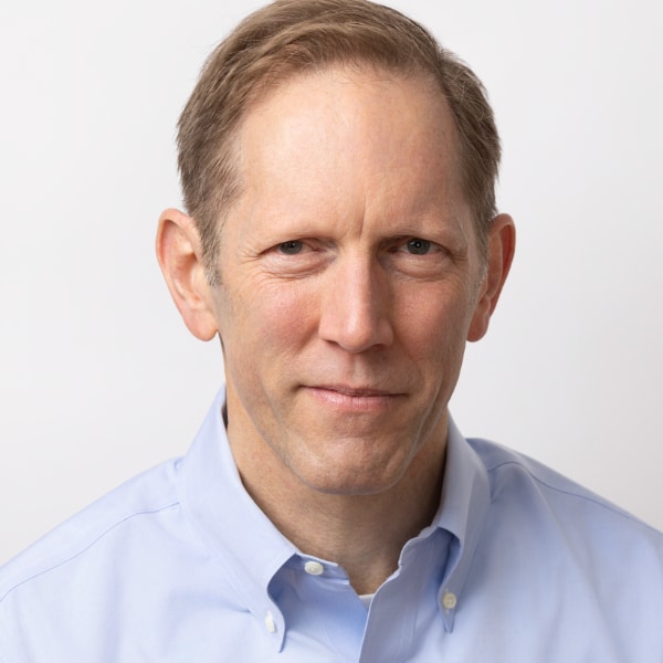Portrait image of technology analyst and media entrepreneur Henry Blodget in front of a white studio background.
