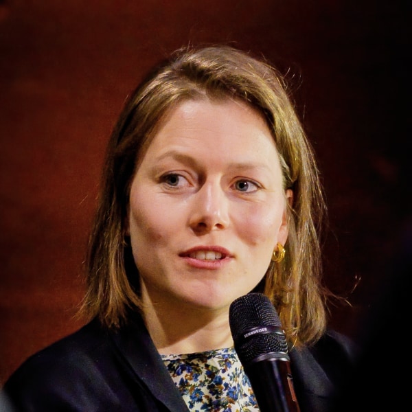 Portrait of BayWa analyst Marie Ammann, speaking at a conference.