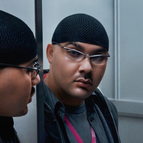 Artistic portrait of musician Emir Timur Tokdemir, known as Mechatok, looking at himself in a mirror.