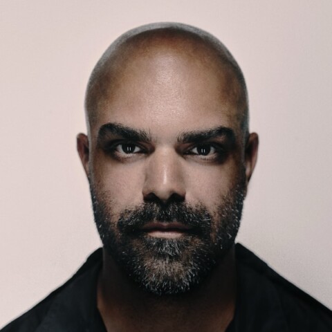 Artistic headshot portrait of Reference Studios founder Mumi Haiati with a duotone look in front of a neutral studio background.