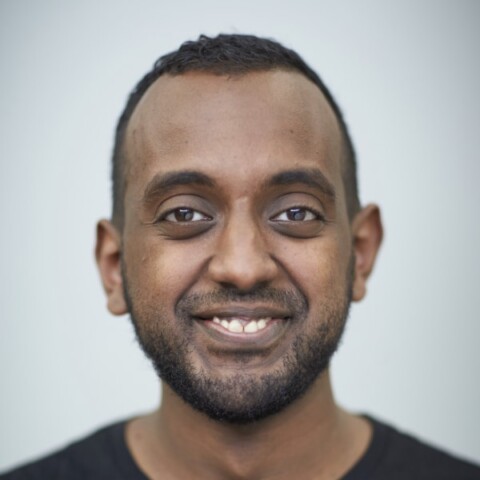 Portrait of Sinksar von Quillfeldt-Ghebremedhin, Netlight, in front of a light grey studio background.