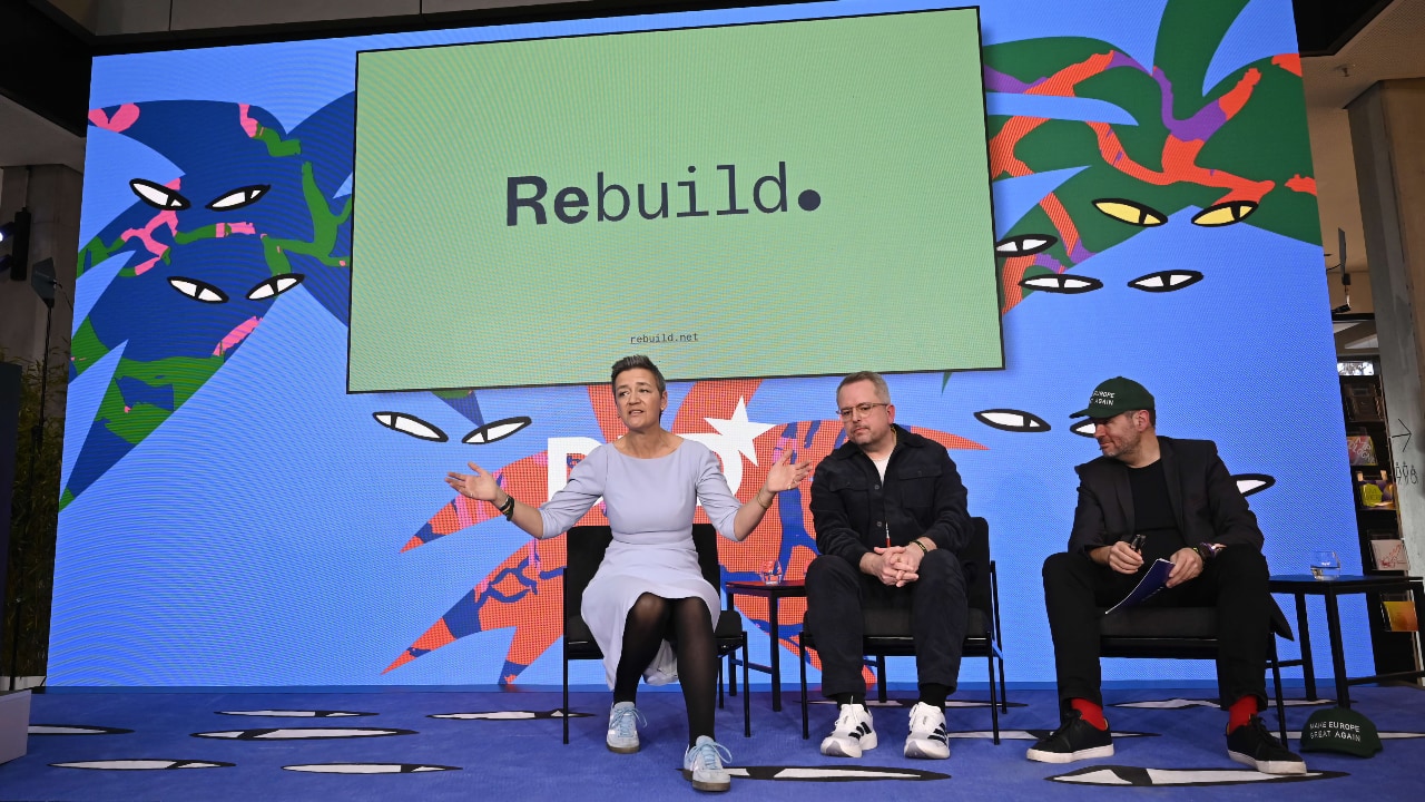 Left to right: Margrethe Vestager and Thomas Madsen-Mygdal (Rebuild) speak with André Loesekrug-Pietri (Joint European Disruptive Initiative) at the DLD Munich Conference 2026. Credit: Sebastian Gabriel / picture alliance for DLD / Hubert Burda Media