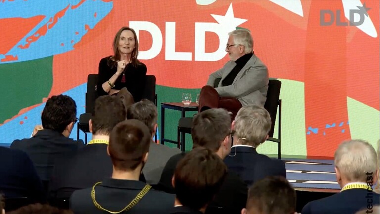 Margit Wennmachers (Andreessen Horowitz) and Paul Achleitner on stage at the DLD Munich 2026 conference, with audience members visible in the foreground. (Video preview)