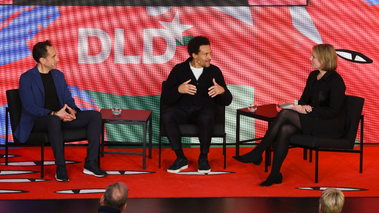 Left to right: Alessandro Centrone (Steelcase), Oliver Heilmer (BMW Group) and Amy Wilkinson (Ingenuity) on stage at the DLD Munich 2026 conference.