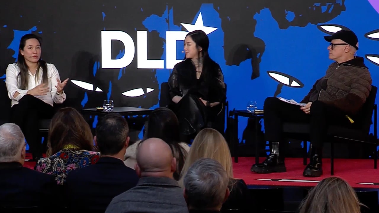 Carol E. Reiley (DeepMusic.ai), Sougwen Chung (Artist) and Hans Ulrich Obrist (Serpentine Galleries) on stage at the DLD Munich 2026 conference.
