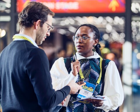 DLD Munich 2026 attendees chatting with each other in the hallway