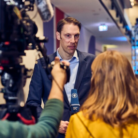 LMU professor Björn Ommer gives an interview to public broadcaster BR at the DLD Munich 2026 conference