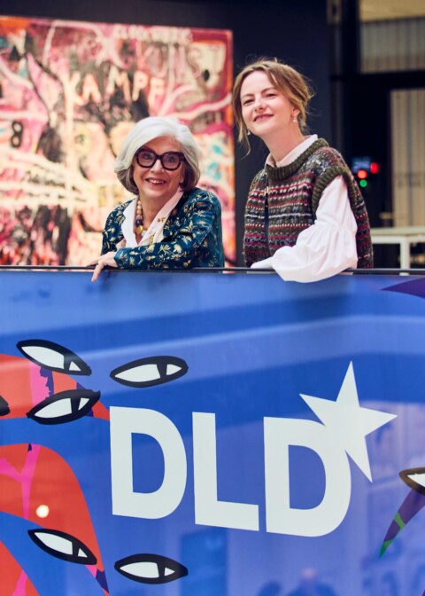 DLD founder Steffi Czerny and DLD Chief Commercial Officer Alessia Sinzger with a poster showing the DLD26 graphic design