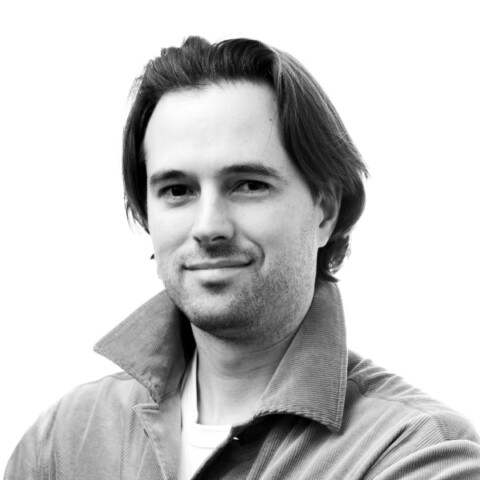 Black-and-white headshot portrait of Andrew McCarthy, founder and CEO of Axo Longevity