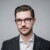 Headshot profile image of Karl Stubbe, Edelman Germany, in front of a grey studio background