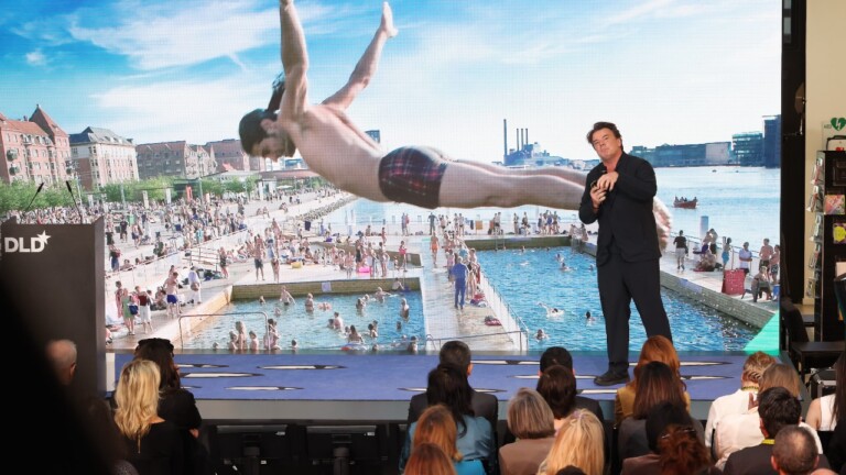 Architect Bjarke Ingels speaking in front of an attentive audience at the DLD Munich Conference 2026. Photo: Karl-Josef Hildenbrand / picture alliance for DLD / Hubert Burda Media