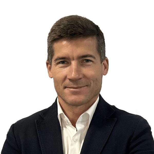 Headshot portrait of Vladimir Liulka, Blocksport, in front of a white background